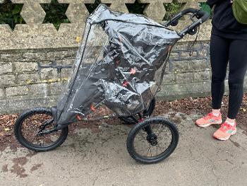 Baby in running buggy 