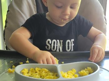 Oliver enjoying some scrambled eggs 