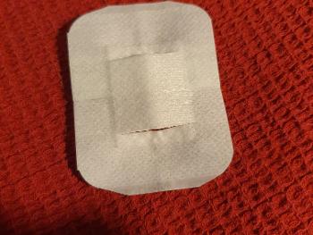 Band aid with slots