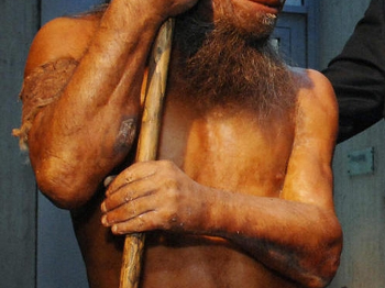 Neanderthal dressed in orange loincloth