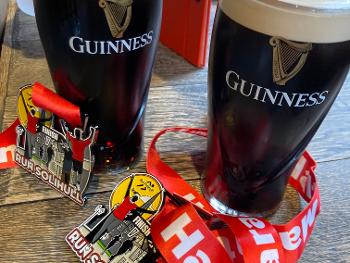Two pints of Guinness with two medals