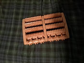Abacus shaped wooden foot roller helps with t o e dystonia.   11"x 7"