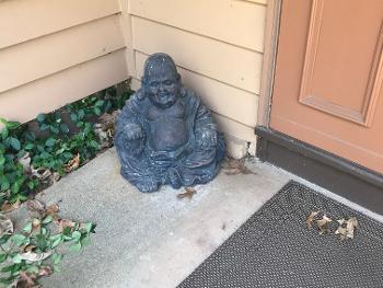 Laughing Guy sits next to my front door.
