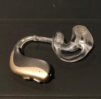 one NHS over the ear hearing aid with a plug fitting for the ear