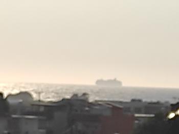 Ship as sun starts setting 