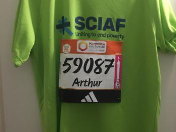 Green running T shirt with SCIAF branding and attached race number.