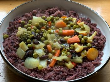 Red rice and black bean curry. 