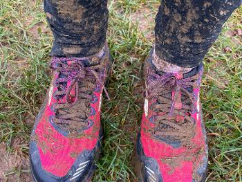 Muddy leggings and trainers