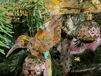Amber hummingbird ornament on a Christmas tree 
