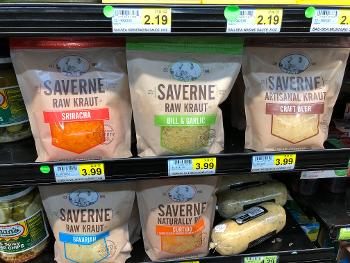Packages of sauerkraut on grocer’s refrigerated section.