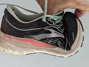 Running shoe with toe folded up