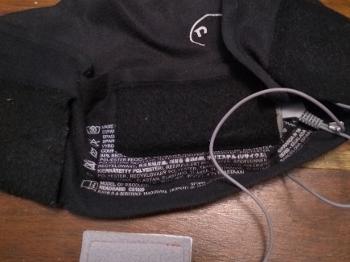 Head band with flat headphones in pockets