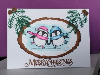 Handmade card of two skating penguins