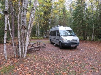 Silver RV in campsite last October