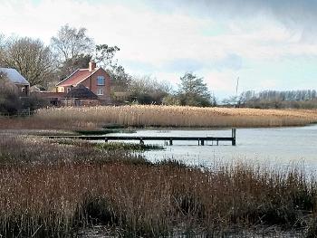 Suffolk estuary with cottage