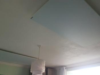 Photo of the pain white panels on the bedroom ceiling. 

