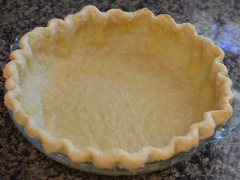 A simple open pastry pie with scalloped edge