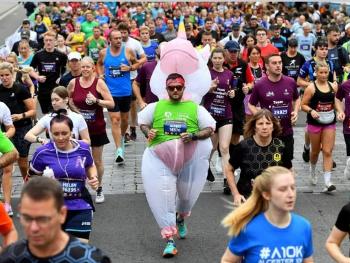 A runner in a unicorn outfit.