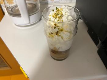 Espresso coffee with pistachio cream and cream 