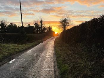 Sunrise along a muddy lane 