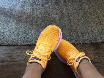 Bright orange new balance running shoes