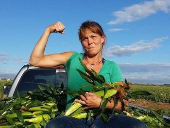 A girl in a truck full of corn 
