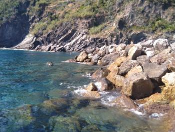 Rocky coastline and the blue waters of the Mediterranean Cinque Terra region of Italy 