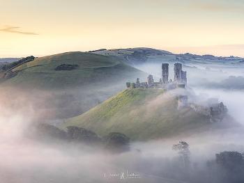Ruined castle seen surrounded by mist