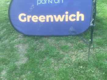 A parkrun logo on green grass