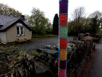 Pole with crocheted squares...