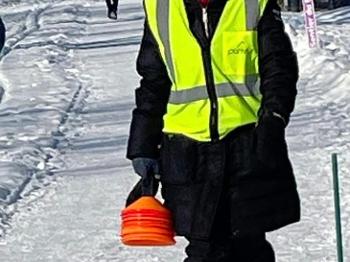 parkrun marshal on a snowy path