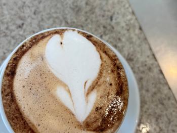 My bartender spotted me. A tulip in the cappuccino symbol of the PD