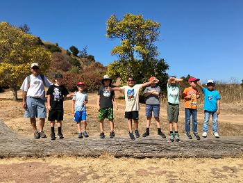 On one of our hikes. My son is in the center with his arms wide open I am on the left end