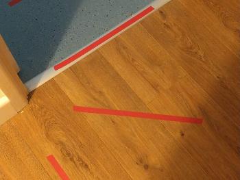 Floor strips guiding through a doorway 