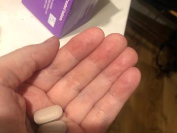 3 lozenge shaped pills in my hand 