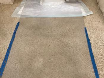 Bed pad cut to fit around toilet base.