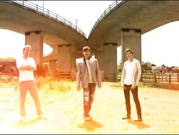 Pop group A-ha performing under a flyover in Sussex