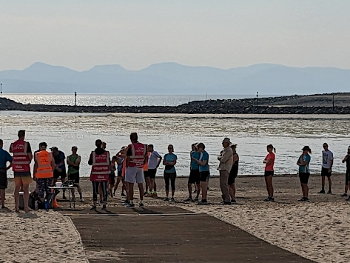 Runners line up for the start of parkrun at the shore.