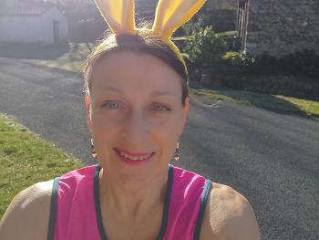 Woman wearing bunny ears, about to run a half- marathon.  Yes, really!