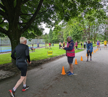 The parkrun finish funnel. A runner is finishing.