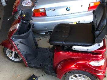 Looks like moped in front, mobility card in back.