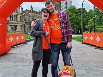 Picture of me, my husband, and Lacie the dog after finishing an MS Society walk.