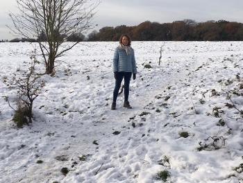 Woman’s standing in snowy field 