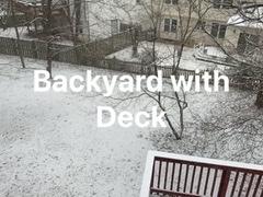 Snowing today on the backyard deck.