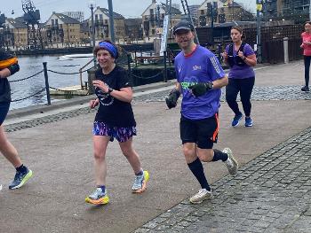 Runners running by old docklands